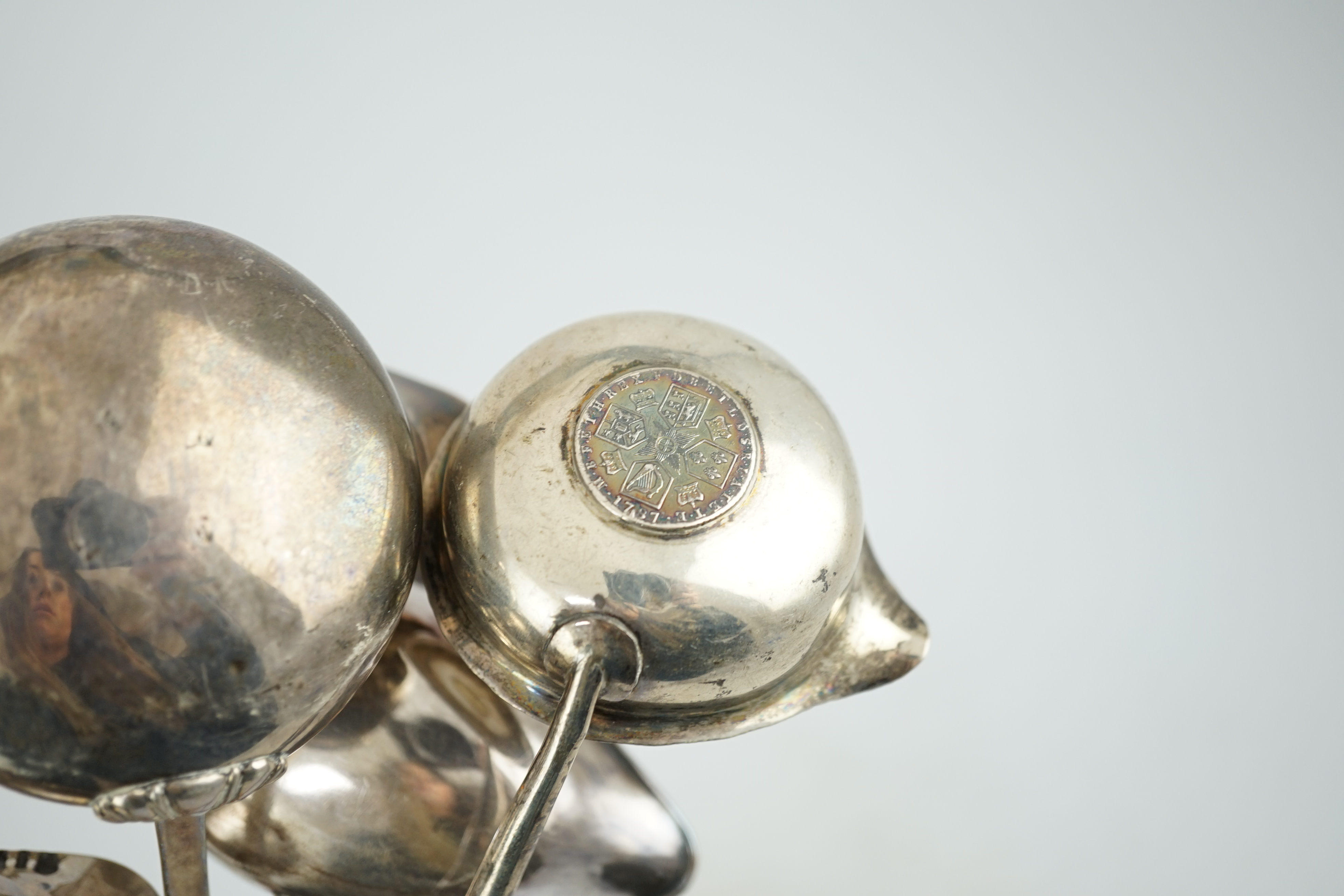 A Georgian silver toddy ladle, makers mark stamped four times (rubbed), 43cm and three other unmarked toddy ladles.